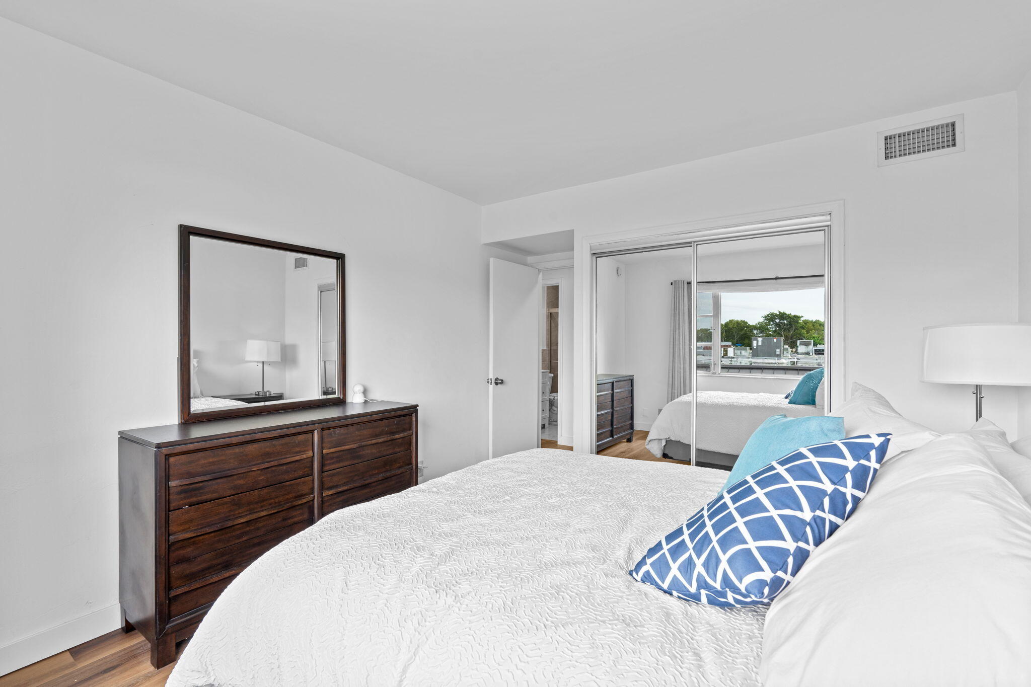 418 South Cypress Road, Unit 128 Pompano Beach, FL 33060 - Photo 23 of 49 a bedroom with a bed and a dresser