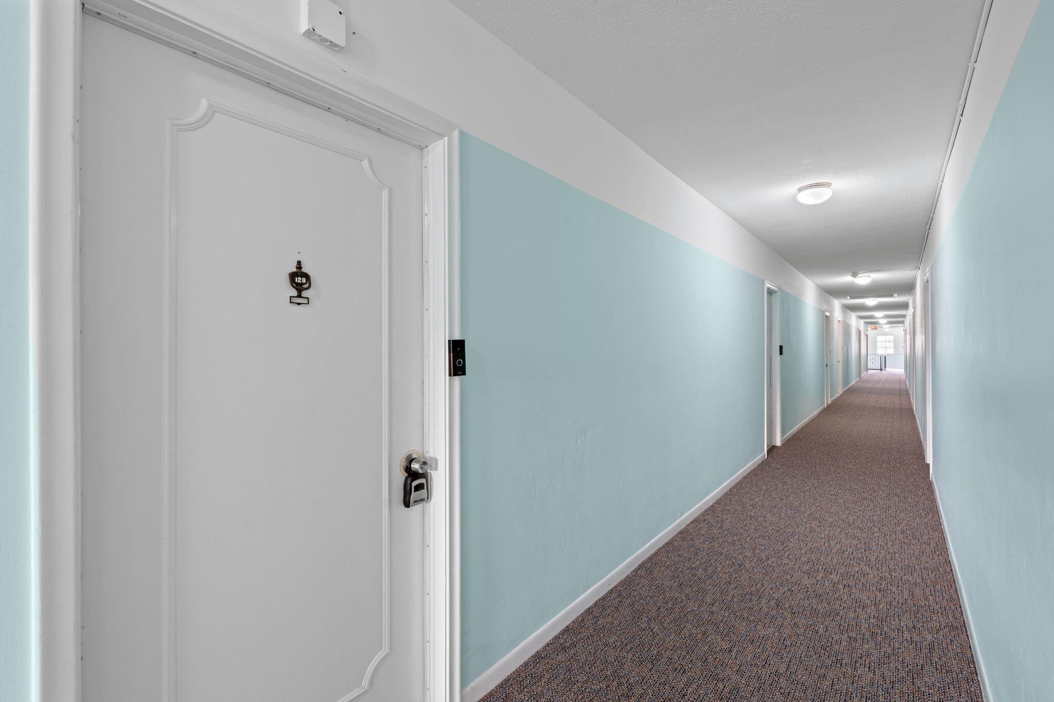 418 South Cypress Road, Unit 128 Pompano Beach, FL 33060 - Photo 27 of 49 a view of hallway with livingroom