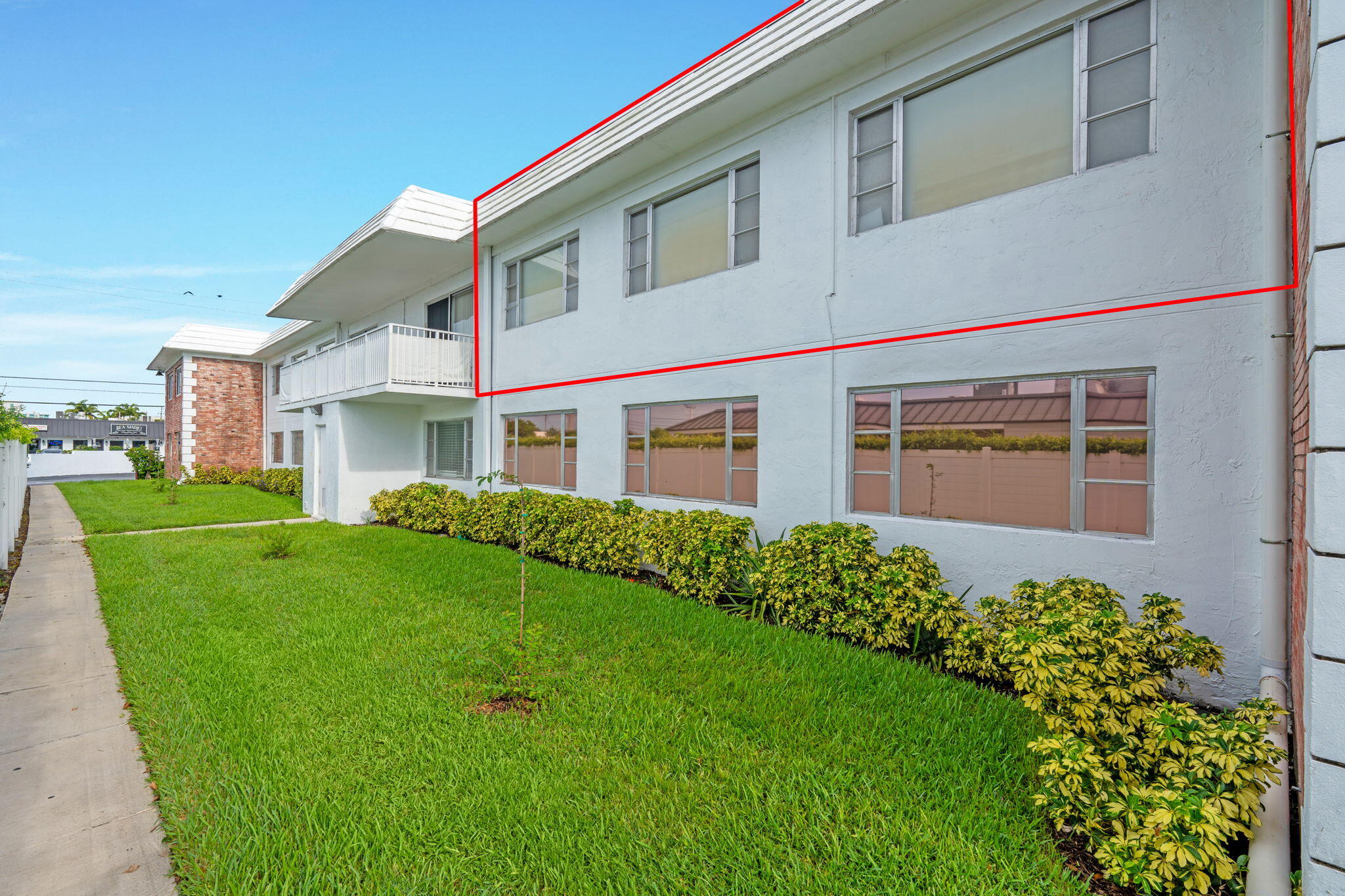 418 South Cypress Road, Unit 128 Pompano Beach, FL 33060 - Photo 28 of 49 a front view of a house with a yard and garage