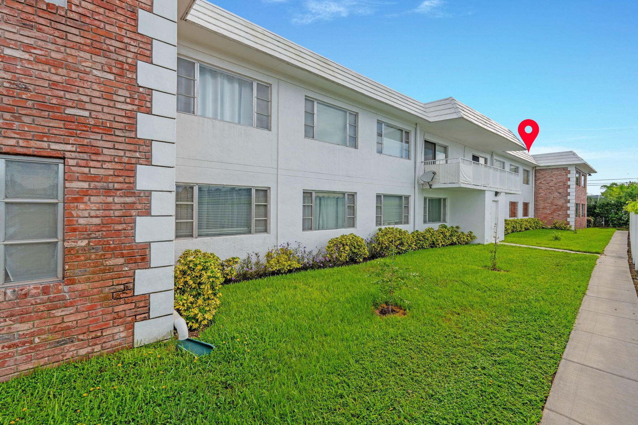 418 South Cypress Road, Unit 128 Pompano Beach, FL 33060 - Photo 29 of 49 a front view of a house with a yard