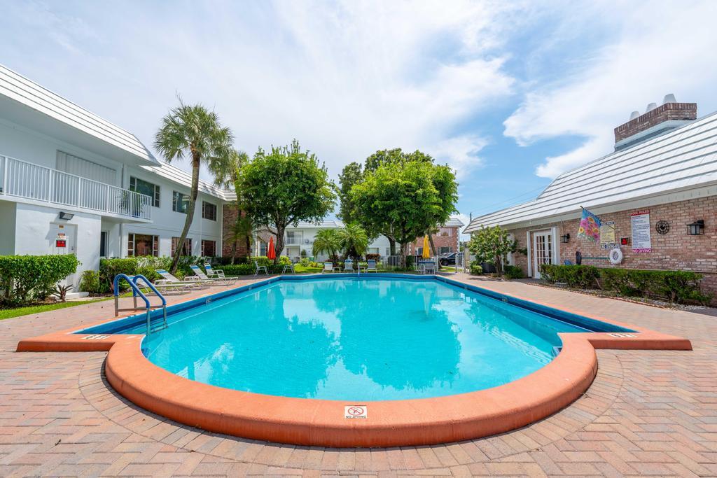 418 South Cypress Road, Unit 128 Pompano Beach, FL 33060 - Photo 33 of 49 a view of outdoor space yard swimming pool and porch