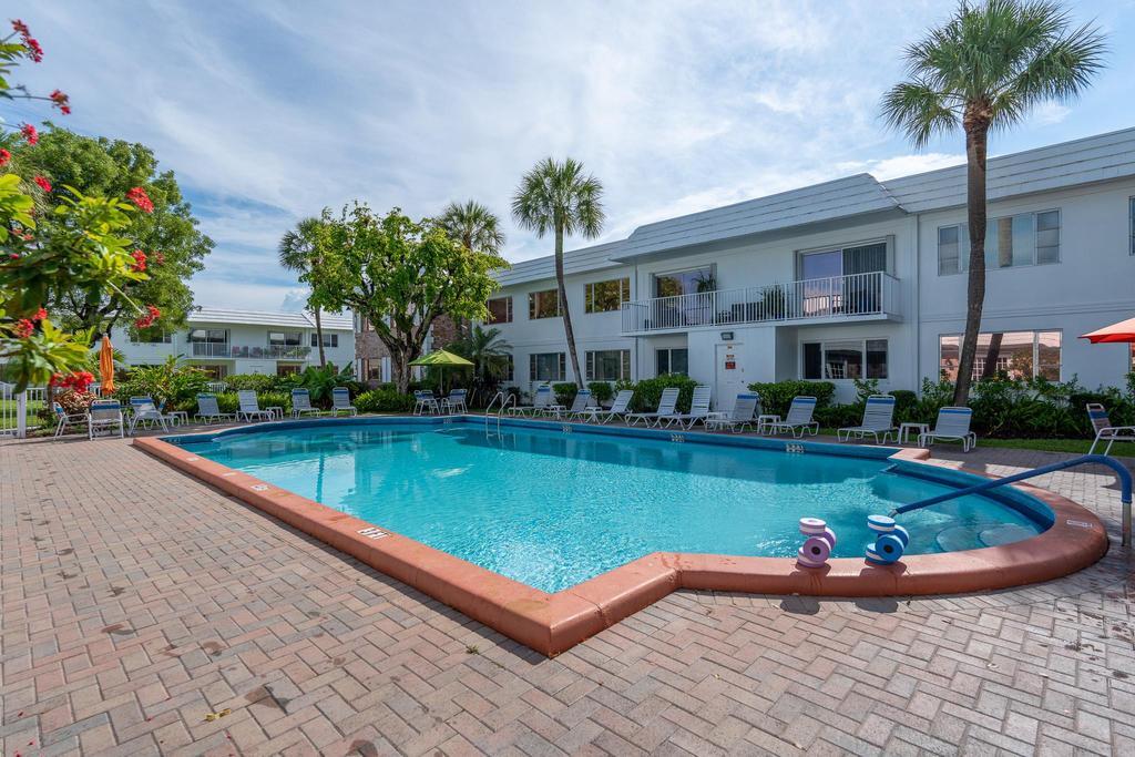 418 South Cypress Road, Unit 128 Pompano Beach, FL 33060 - Photo 40 of 49 a view of a house with swimming pool