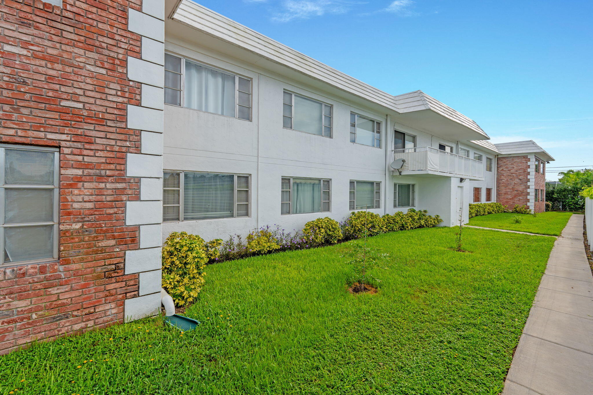 418 South Cypress Road, Unit 128 Pompano Beach, FL 33060 - Photo 45 of 49 a front view of a house with a yard