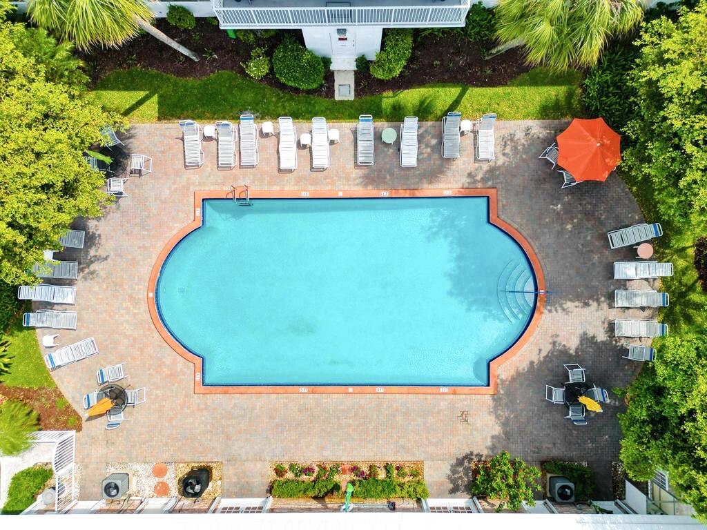418 South Cypress Road, Unit 128 Pompano Beach, FL 33060 - Photo 5 of 49 a view of a swimming pool with sitting area