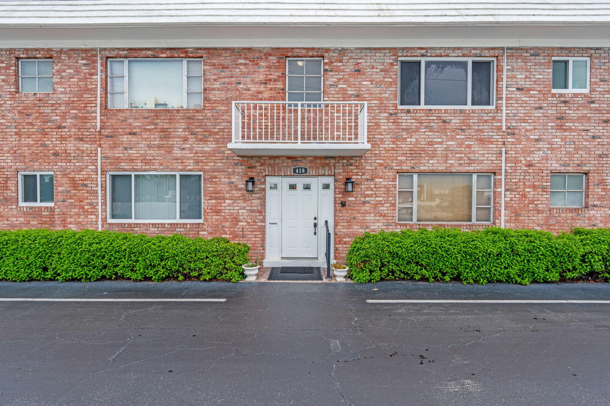 418 South Cypress Road, Unit 128 Pompano Beach, FL 33060 - Photo 8 of 49 a front view of a house with a garden