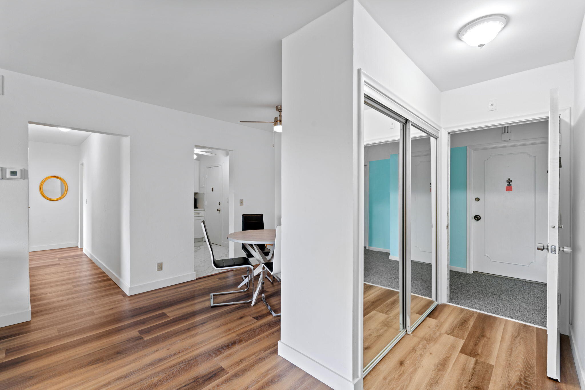 418 South Cypress Road, Unit 128 Pompano Beach, FL 33060 - Photo 10 of 49 a view of a hallway with wooden floor and staircase