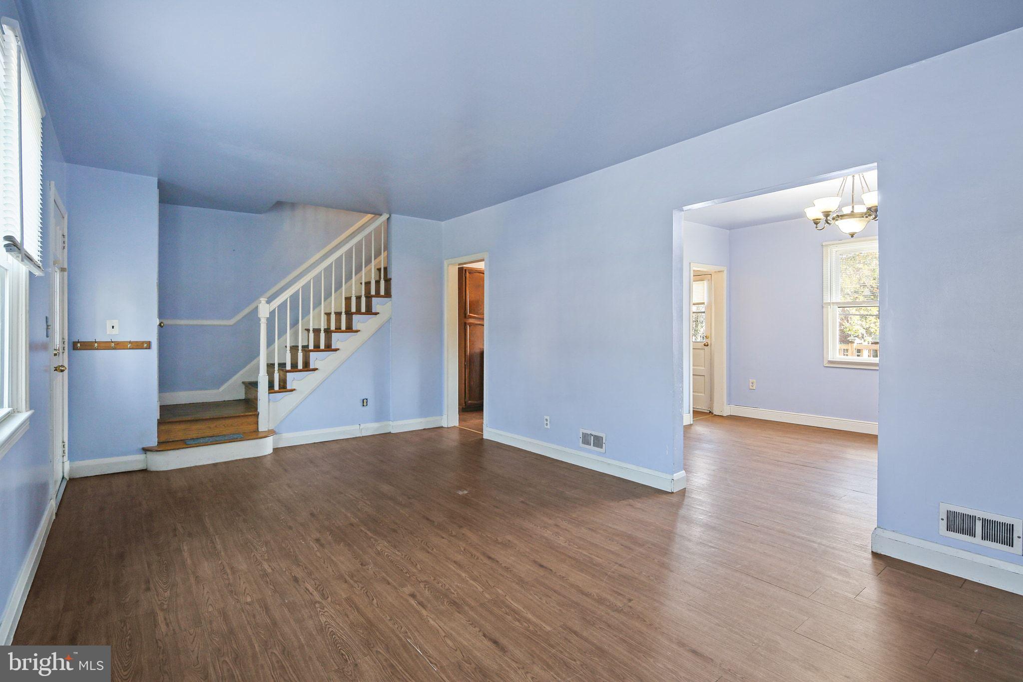 49 Briarwood Road Baltimore, MD 21228 - Photo 4 of 17 a view of an empty room with wooden floor and a window