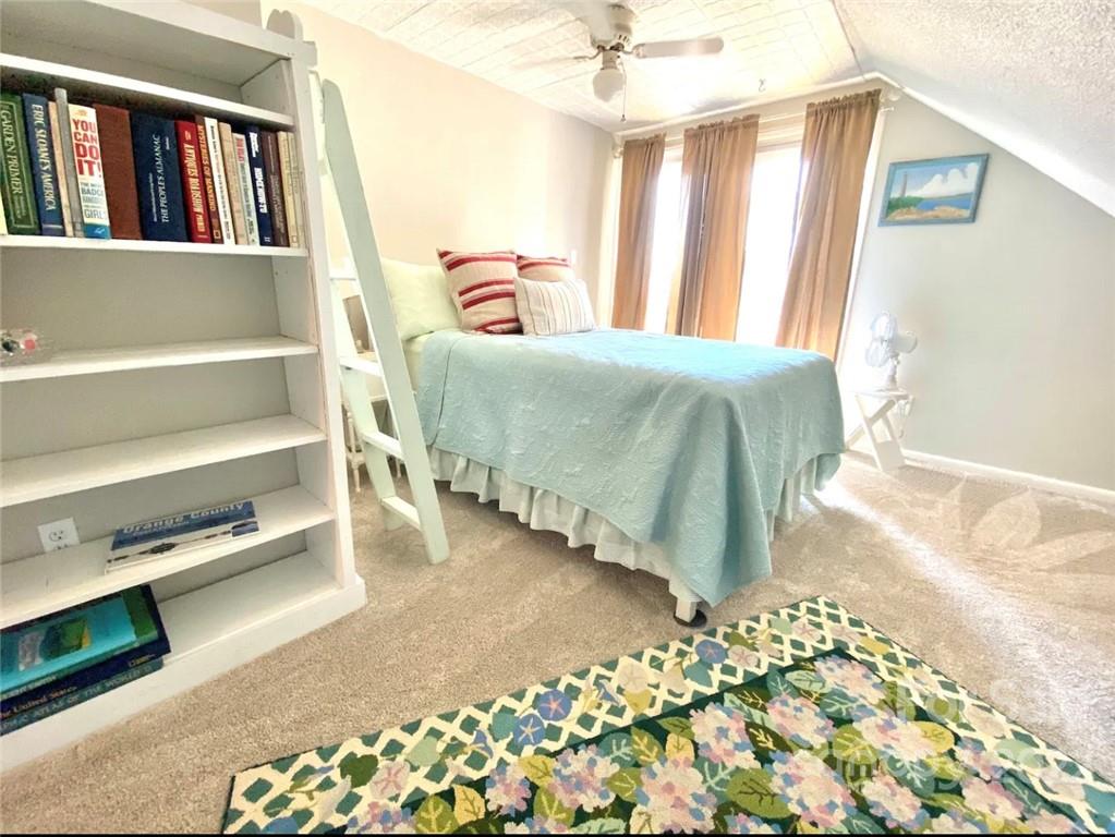 350 East Boiling Spring Road Southport, NC 28461 - Photo 3 of 15 a bedroom with a bed and a window