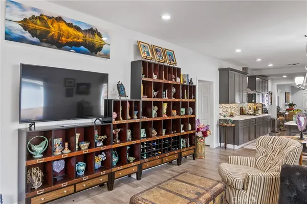 a living room with furniture cabinets and a book shelf