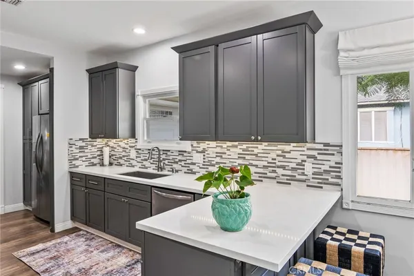a kitchen with a sink and cabinets