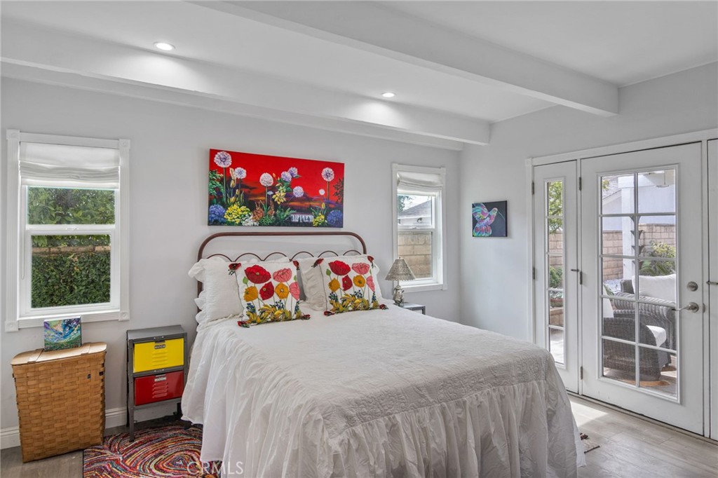 1007 Rose Avenue Pasadena, CA 91107 - Photo 22 of 52 a bedroom with bed and wooden floor