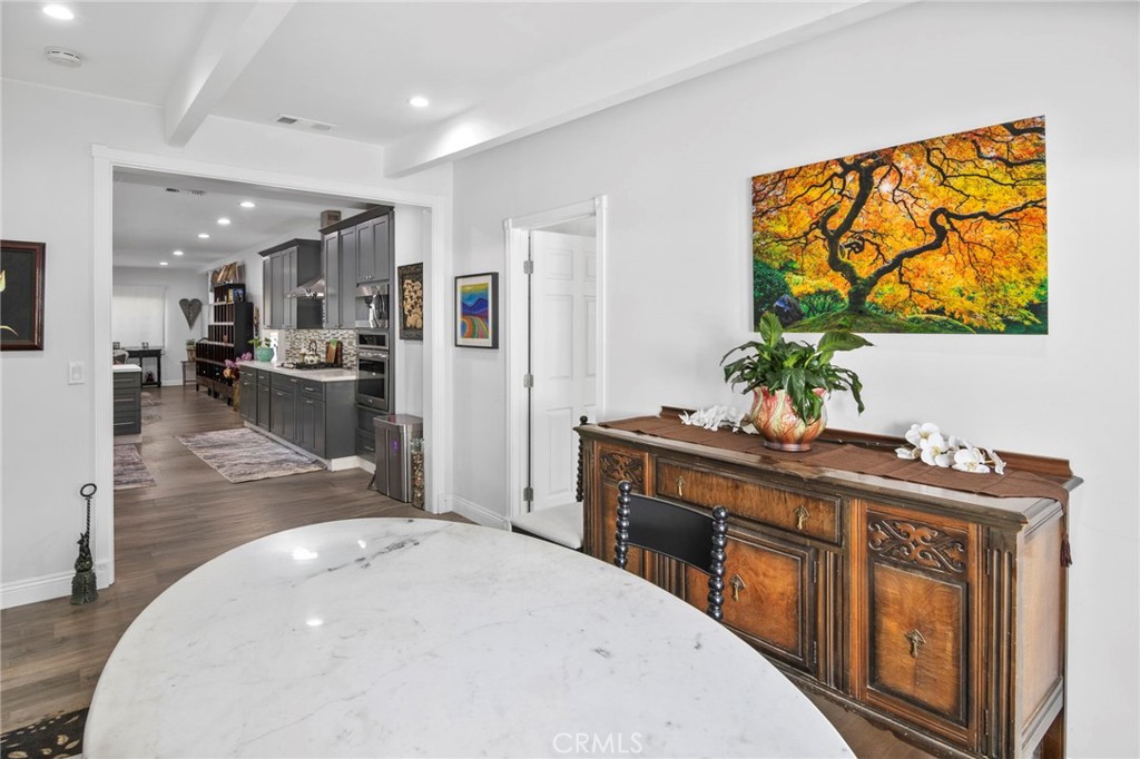 1007 Rose Avenue Pasadena, CA 91107 - Photo 28 of 52 a living room with stainless steel appliances furniture a chandelier and a dining table