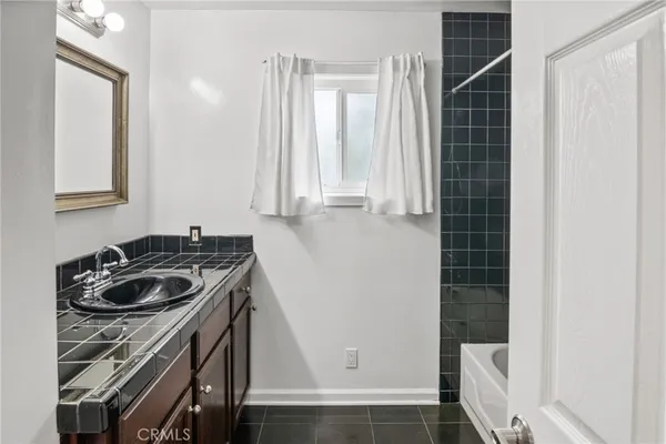 a kitchen with a stove and a sink