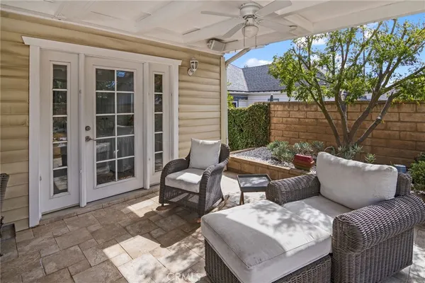 a outdoor living space with furniture and a potted plant