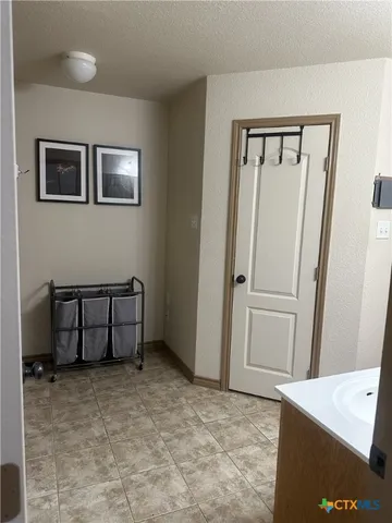 a view of a hallway with some storage area