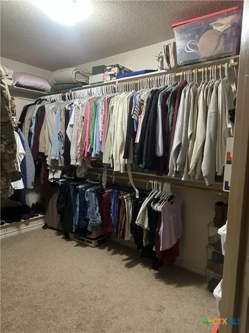 a bedroom with bed and a table