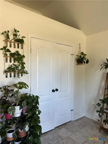 a view of a entryway with flower pots