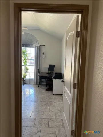 a living room with furniture and a gate