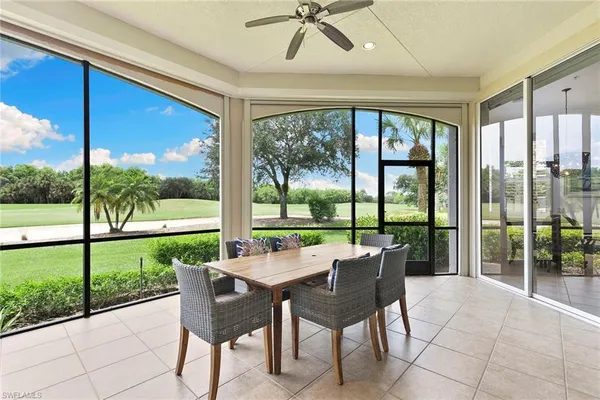 a view of a porch with furniture and garden