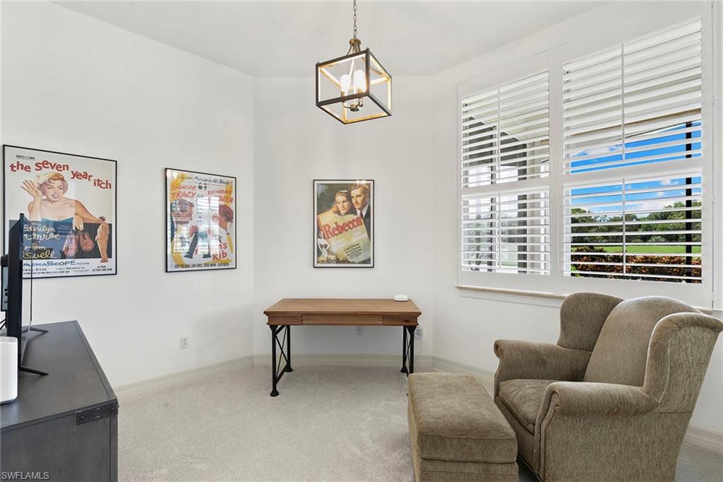 17005 Porta Vecchio Way, Unit 102 Naples, FL 34110 - Photo 20 of 50 a living room with furniture and a window