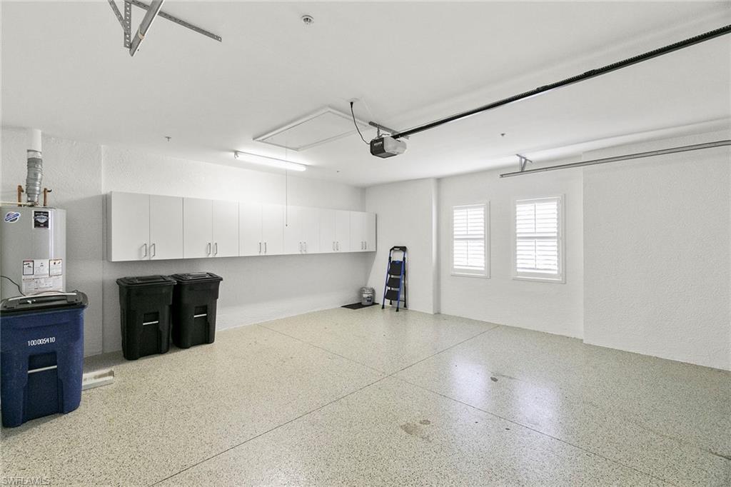 17005 Porta Vecchio Way, Unit 102 Naples, FL 34110 - Photo 25 of 50 a view of a kitchen with a sink and a refrigerator