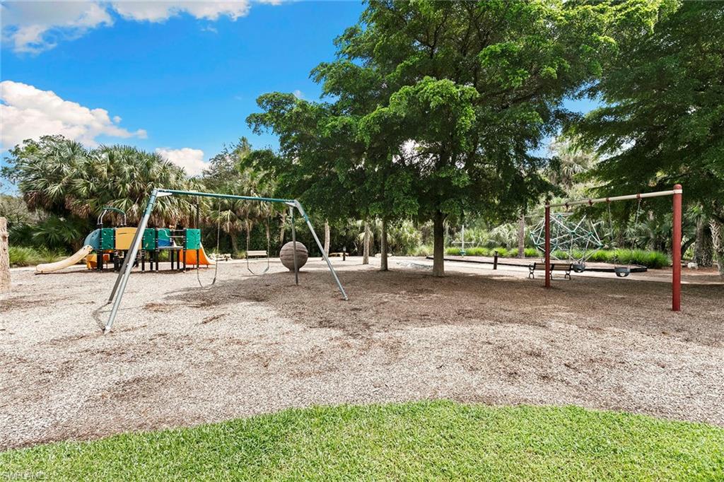 17005 Porta Vecchio Way, Unit 102 Naples, FL 34110 - Photo 30 of 50 a view of outdoor space with garden and trees