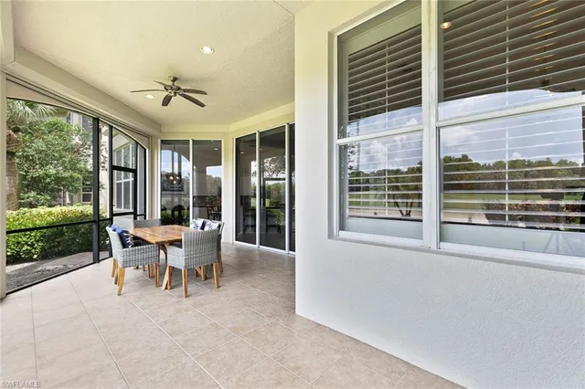 a view of a patio with a dining table and chairs