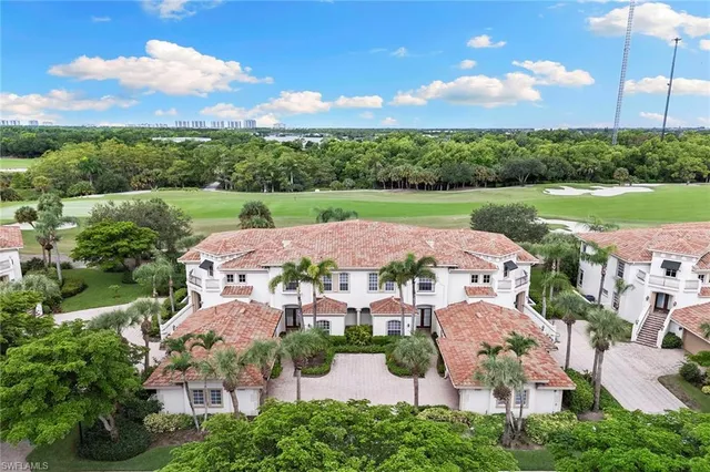 an aerial view of a house with garden space and street view