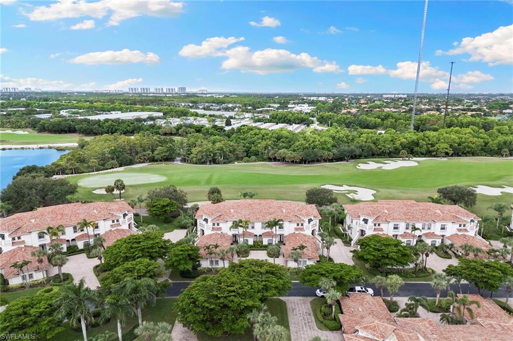 17005 Porta Vecchio Way, Unit 102 Naples, FL 34110 - Photo 35 of 50 an aerial view of a houses with outdoor space and city view