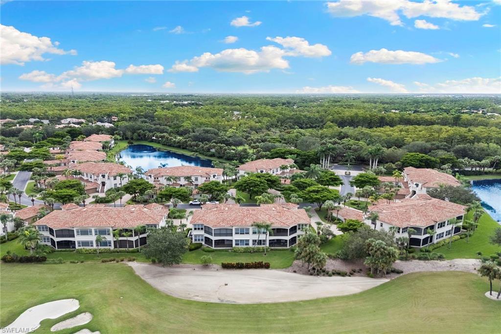 17005 Porta Vecchio Way, Unit 102 Naples, FL 34110 - Photo 38 of 50 a view of a lake with houses