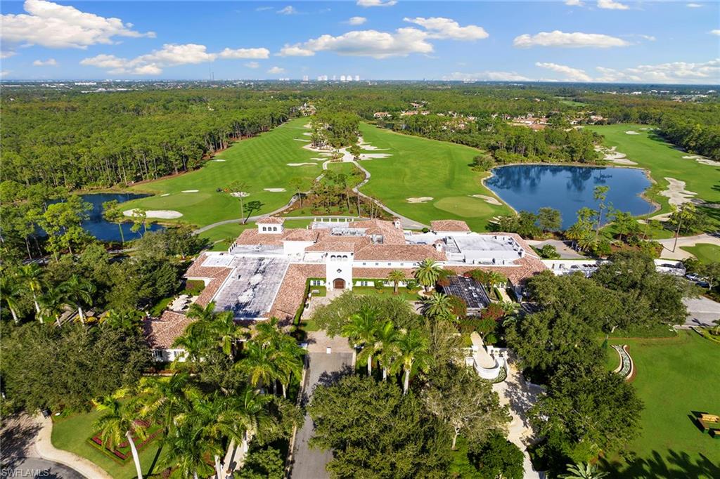 17005 Porta Vecchio Way, Unit 102 Naples, FL 34110 - Photo 46 of 50 a view of a city with mountains in the background
