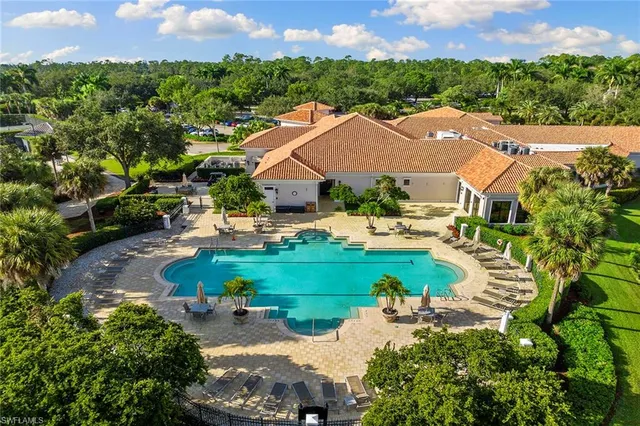 an aerial view of a house with outdoor space