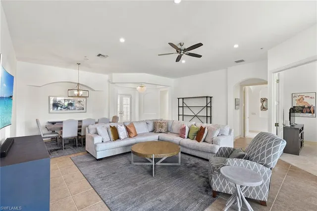 a living room with furniture and a rug