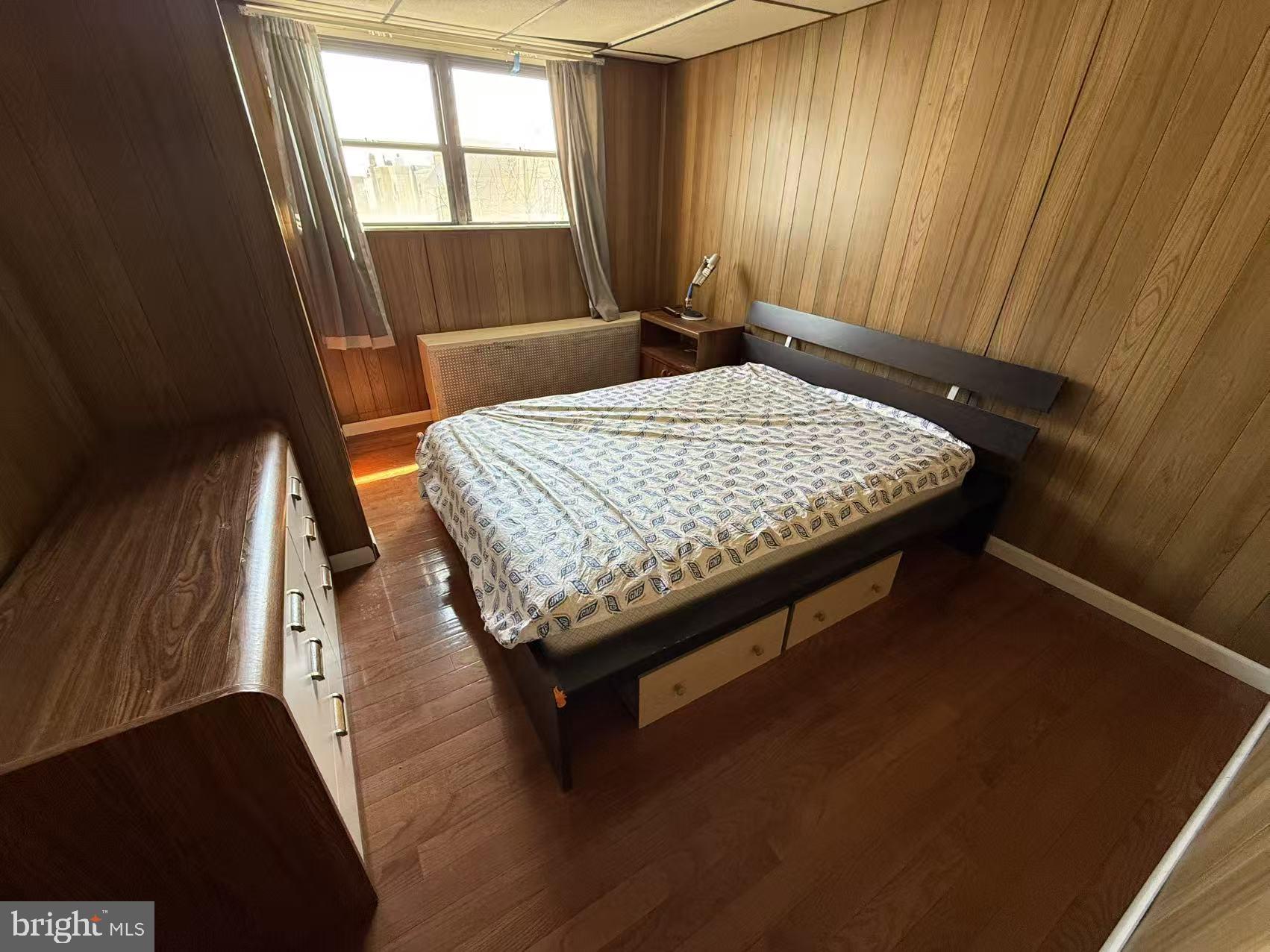 1733 South 9th Street Philadelphia, PA 19148 - Photo 11 of 14 a bed sitting in a bedroom next to a window