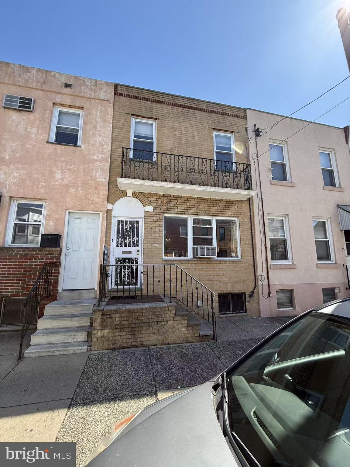 1733 South 9th Street Philadelphia, PA 19148 - Photo 2 of 14 a front view of a house with a yard