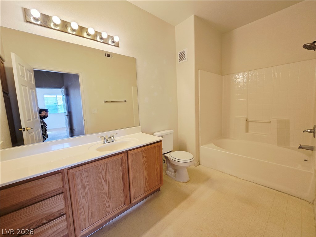 9580 West Reno Avenue, Unit 283 Las Vegas, NV 89148 - Photo 9 of 19 Full bath with vanity, shower combination, and light floors