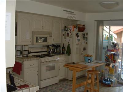 2437 Center Road Novato, CA 94947 - Photo 4 of 7 a kitchen with stainless steel appliances granite countertop a stove a sink and a refrigerator