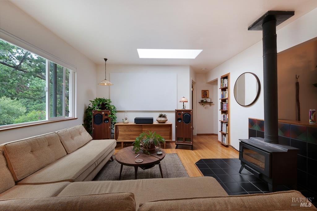 4542 Thomas Road Sebastopol, CA 95472 - Photo 49 of 60 a living room with furniture a large window and a potted plant