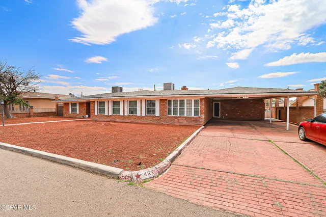 a view of house with yard