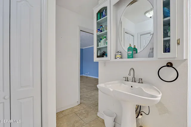 a bathroom with a sink a mirror and a bathtub