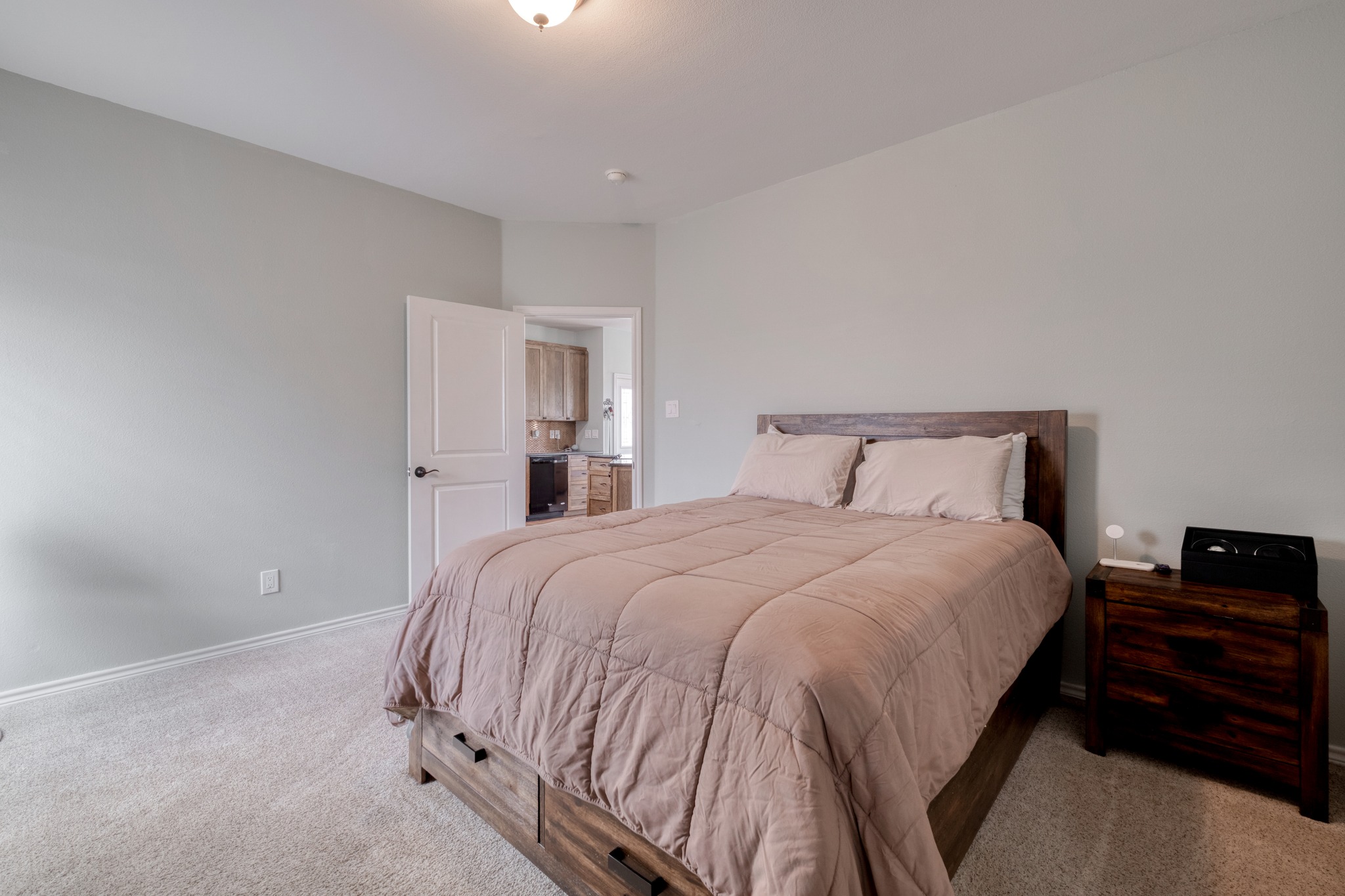 2950 County Road 484 Elgin, TX 78621 - Photo 14 of 25 a bedroom with a bed and dresser