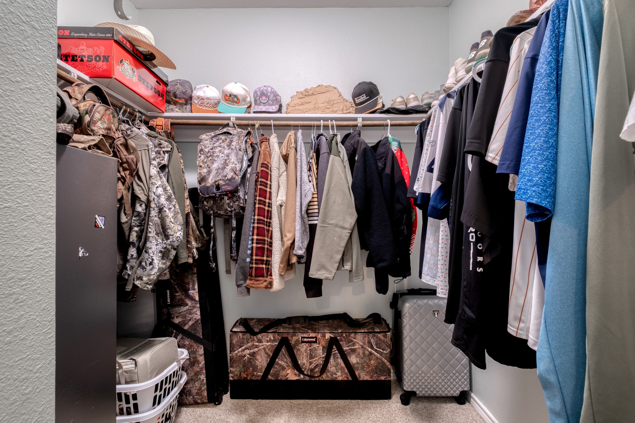2950 County Road 484 Elgin, TX 78621 - Photo 16 of 25 a view of walk in closet with clothes and shoes