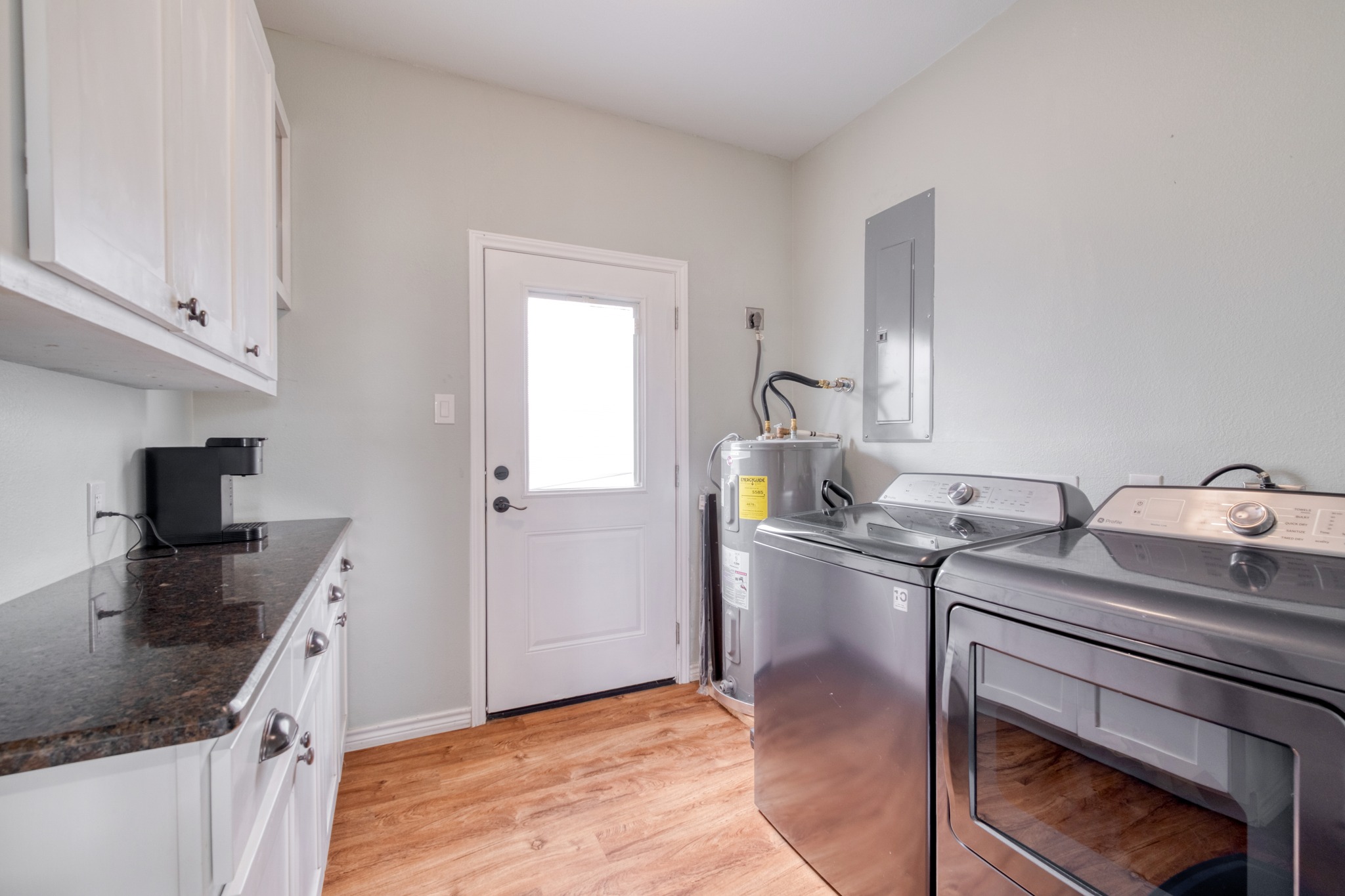 2950 County Road 484 Elgin, TX 78621 - Photo 20 of 25 a kitchen with sink stove and cabinets