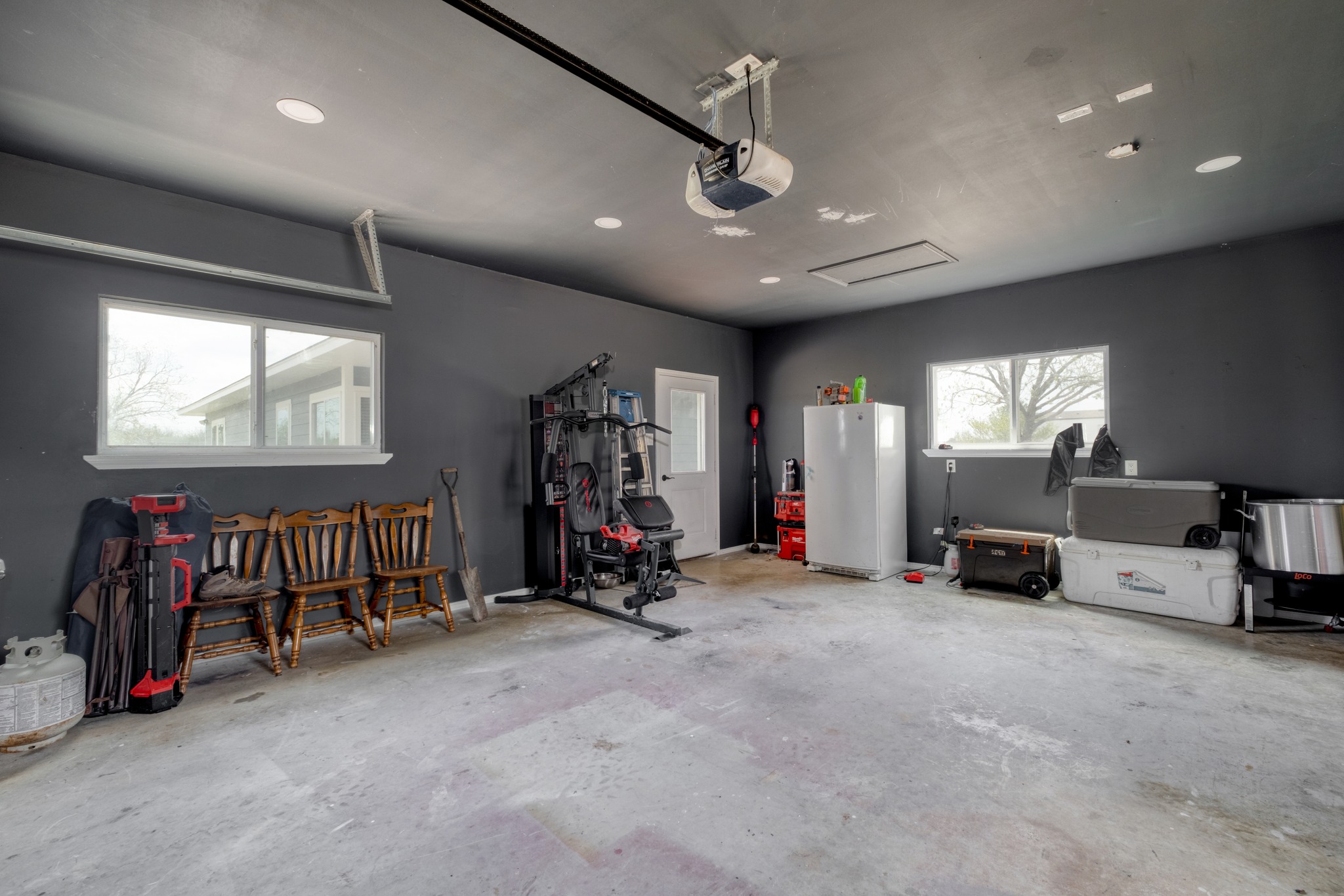 2950 County Road 484 Elgin, TX 78621 - Photo 24 of 25 a view of a room with gym equipment and a large window
