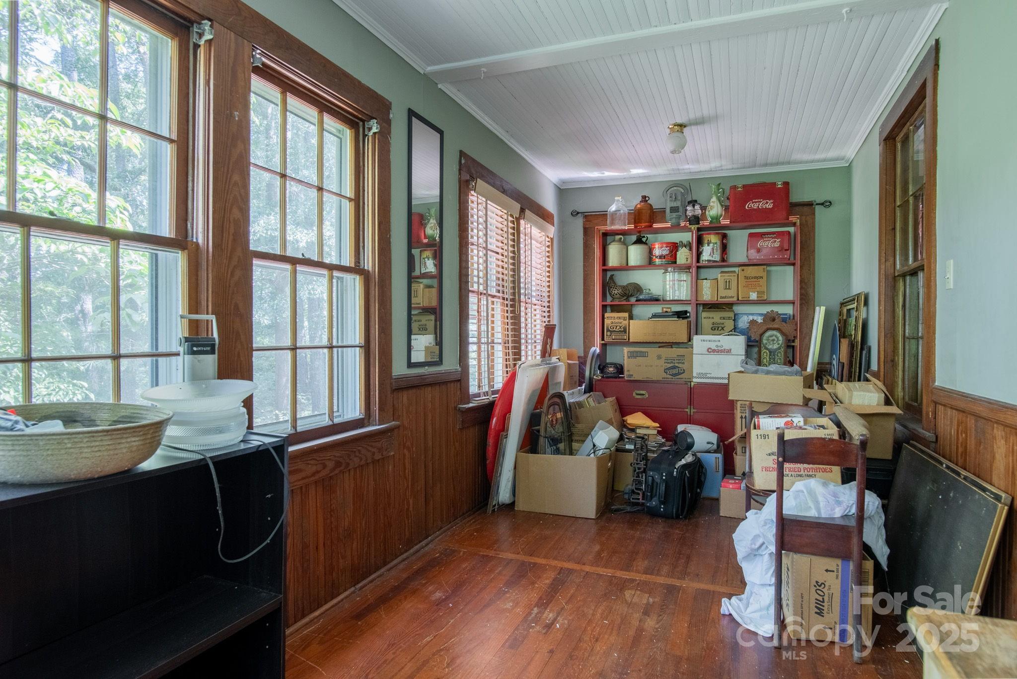 109 Fulton Street, Unit 9 Kings Mountain, NC 28086 - Photo 18 of 46 a room with lots of wooden furniture and a large window