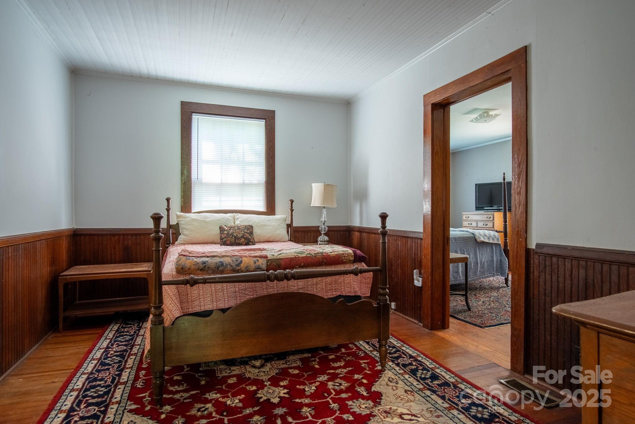 109 Fulton Street, Unit 9 Kings Mountain, NC 28086 - Photo 22 of 46 a bedroom with a bed and a couch