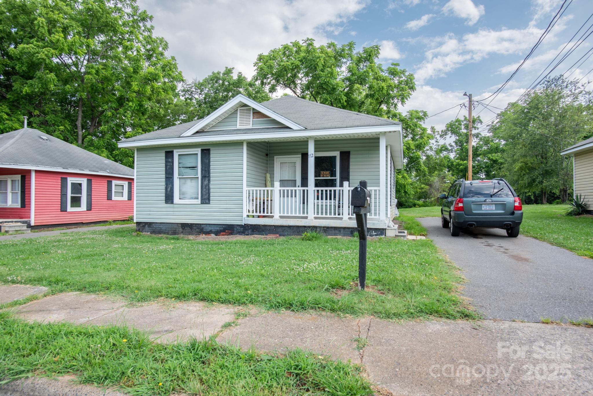 109 Fulton Street, Unit 9 Kings Mountain, NC 28086 - Photo 27 of 46 a front view of a house with a garden and yard