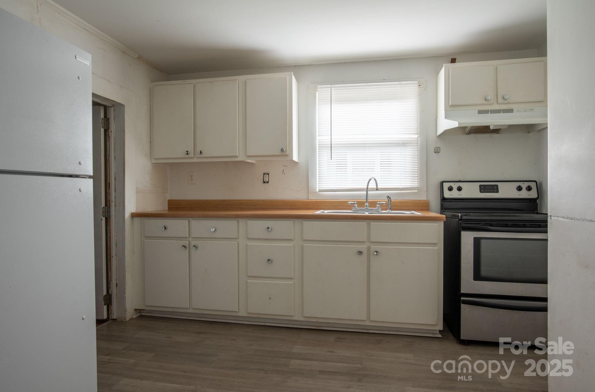 109 Fulton Street, Unit 9 Kings Mountain, NC 28086 - Photo 39 of 46 a kitchen with a sink cabinets and appliances