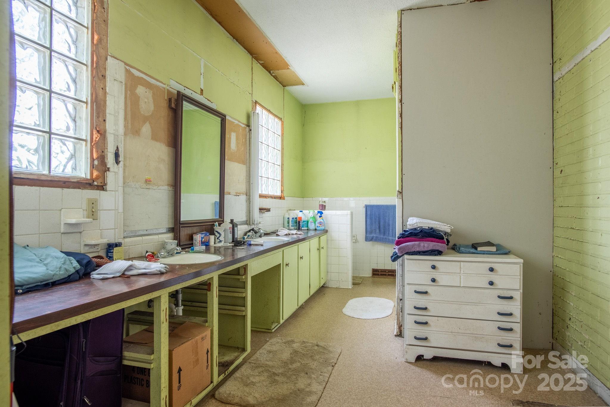 109 Fulton Street, Unit 9 Kings Mountain, NC 28086 - Photo 44 of 46 a bathroom with a double vanity sink and a mirror