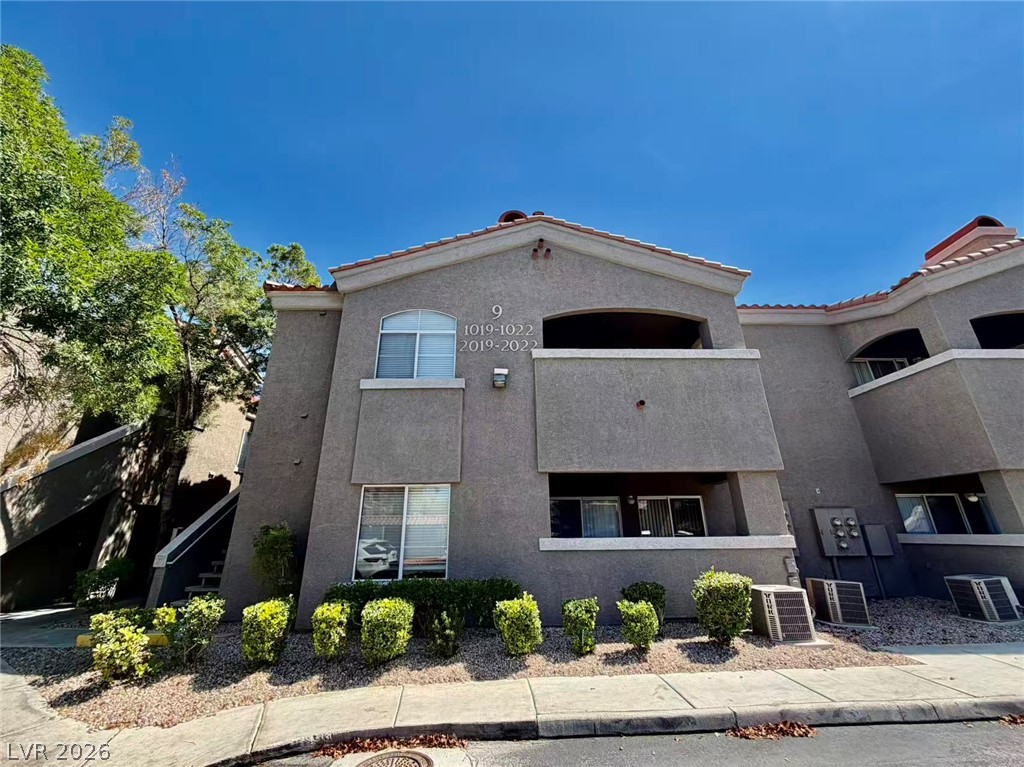 5525 West Flamingo Road, Unit 1019 Las Vegas, NV 89103 - Photo 1 of 18 A classic stucco exterior with red tile roofing exudes timeless Southwestern charm.